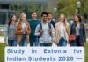 Indian student walking with international students at a university campus in Estonia 2026